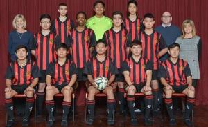 Hamilton boys senior green soccer team and their coaches.